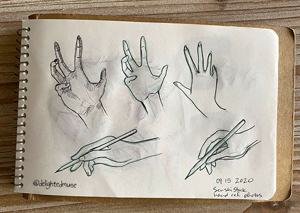 A sketchbook page showing hand studies drawn in black pen