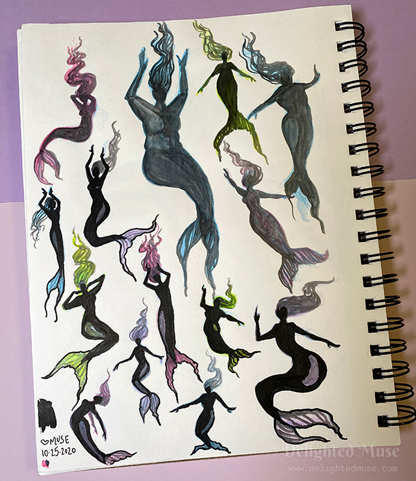 A sketchbook page showing mermaid silhousettes, painted in ink and pastel watercolor