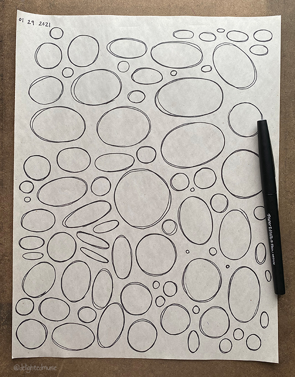 A newsprint sheet of ellipses drawn in felt pen