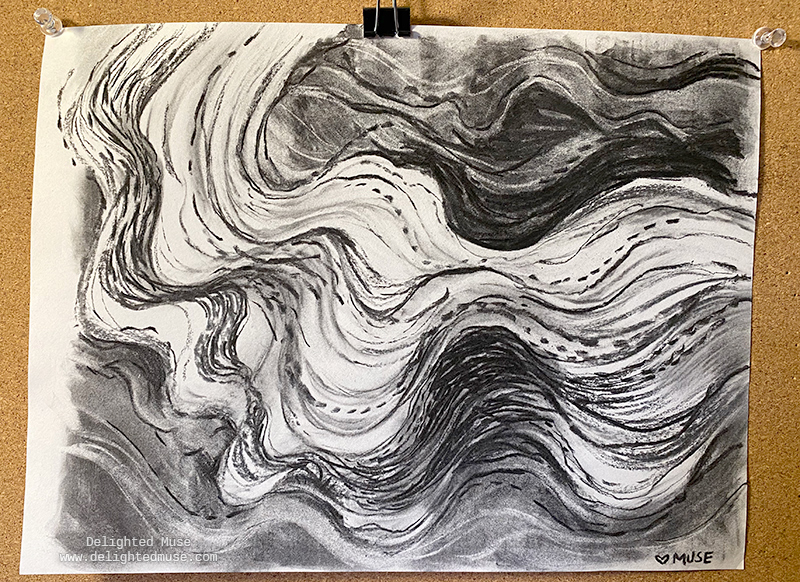 Charcoal drawing of flowing, smoke-like marks on white paper, with the drawing pinned to a bulletin board.