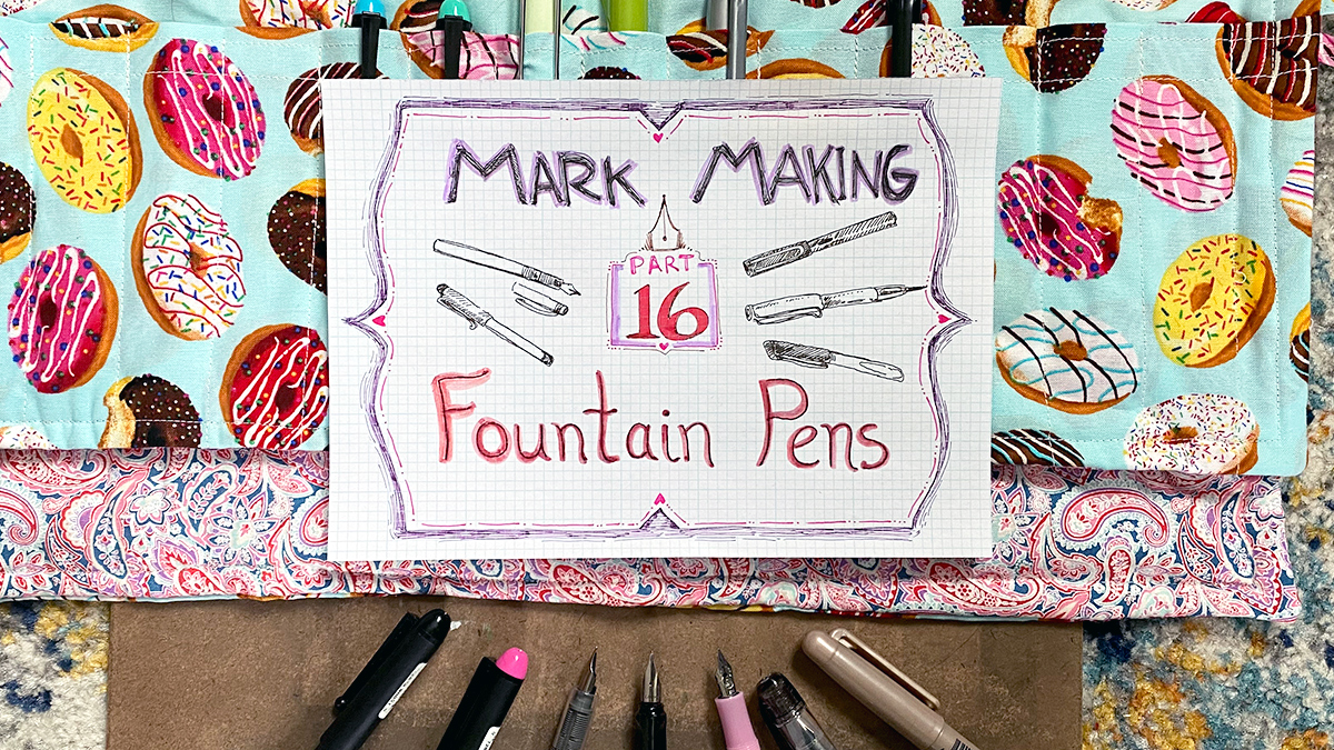 A photo of fountain pens in a roll up case, with a sheet of graph paper that says the words mark making part 16 fountain pens