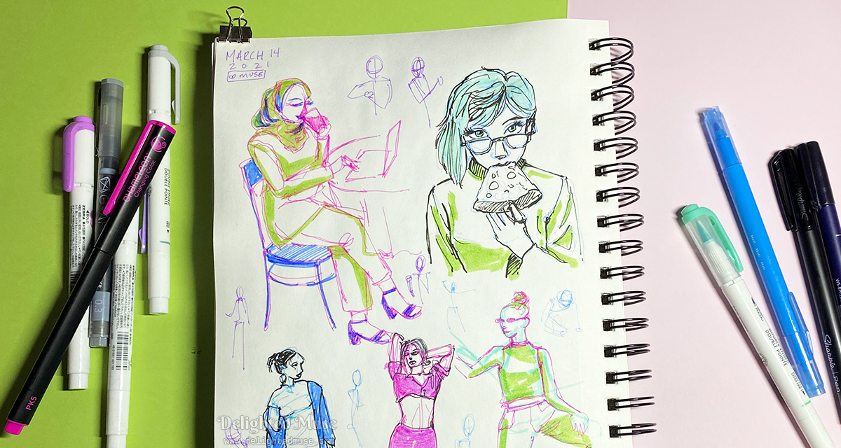 A sketchbook page with figure sketches, including a girl eating a slice of pizza. Piles of pens are laid next to the sketchbook on both sides.