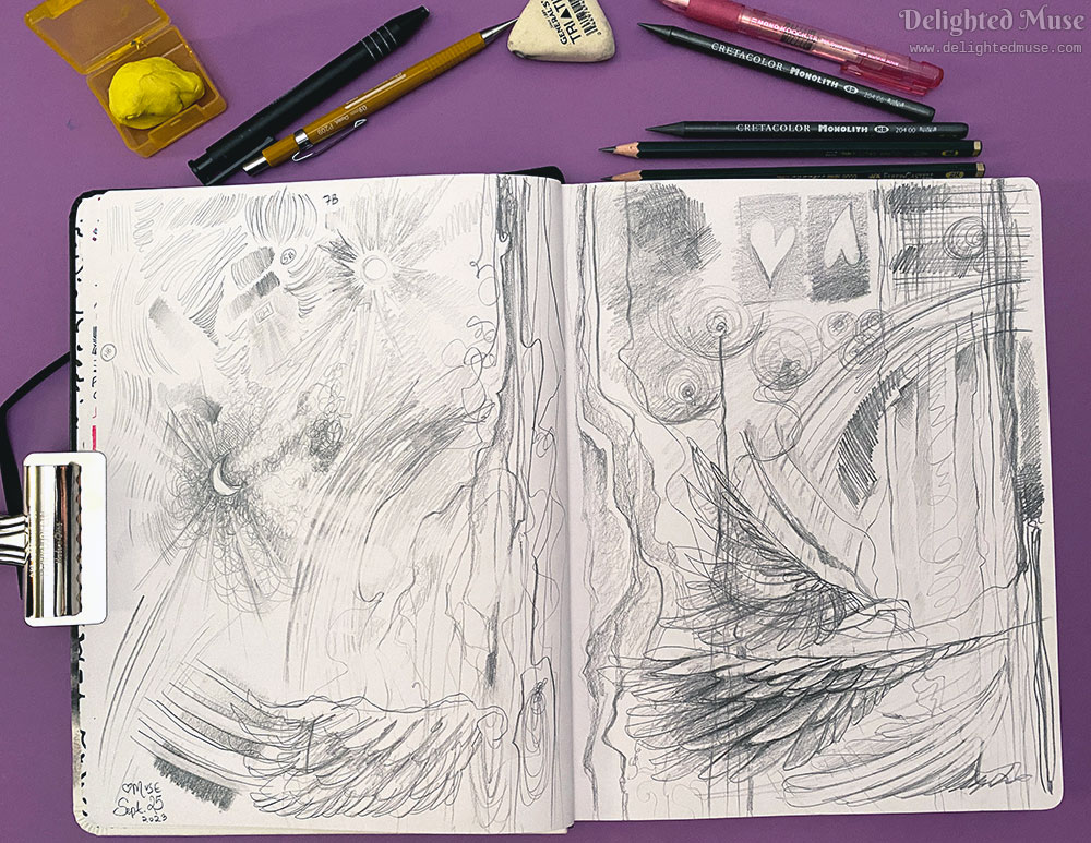 A photo of an open sketchbook, with pencils and erasers scattered above. On the sketchbook pages are scribbles and doodles, some of which look like feathers.