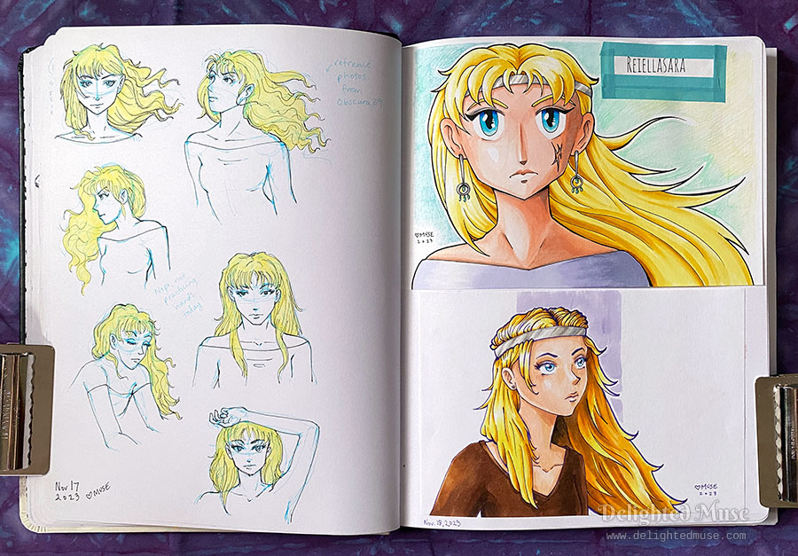 Photo of an open sketchbook showing two pages with drawings. On the left are quick sketches of a woman's head and shoulders drawn at various angles, with the hair colored blonde. On the right is a heavily styled anime drawing of a frowning blond woman with a silver circlet and earrings. The lower portion of the page shows the same character with a softer style. Text in the upper right shows the character's name as Reiellasara.