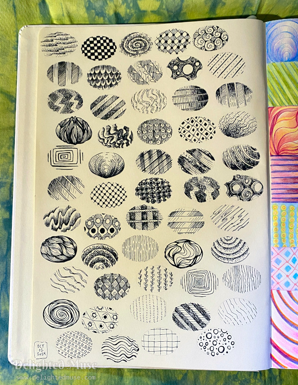 A sketchbook page with multiple ellipses filled with inked abstract patterns.