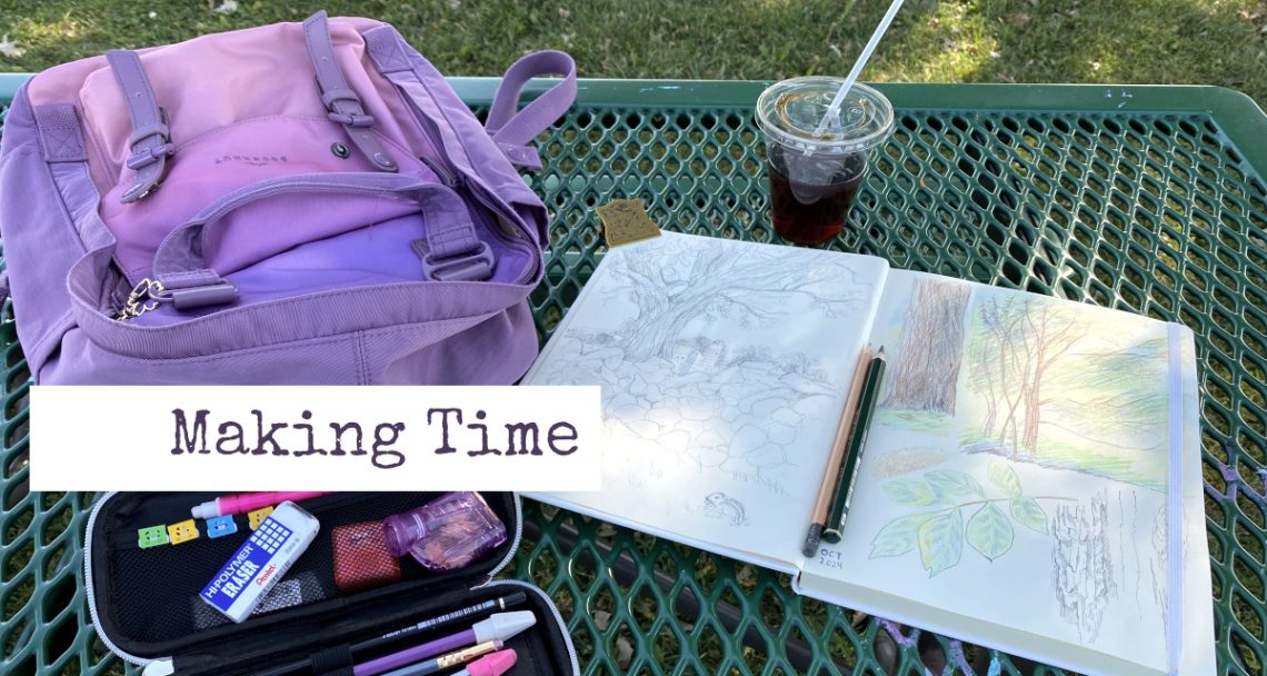 Photo of a green, metal picnic table. Ontop of the table is a an open sketchbook with drawings of trees, an plastic cup of iced coffee, a purple backpack, and a pencil case with art pencils and erasers.